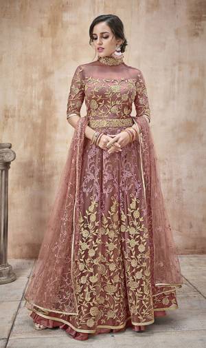 Add This New Shade In Pink To Your Wardrobe With This Designer Floor Length Suit In Onion Pink Color. Its Heavy Embroidered Top And Dupatta Are Net Based Paired With Satin Silk Bottom. Buy Now.
