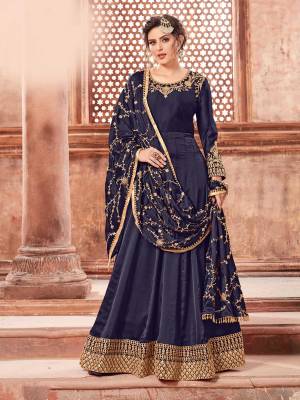 You Will Definitely Earn Lots Of Compliments Weairng This Designer Floor Length Suit In Navy Blue Color Paired With Navy Blue Colored Bottom And Dupatta. Its Top Is Fabricated On Satin Georgette Paired With Santoon Bottom And Heavy Embroidered Chinon Dupatta. The Main Highlight In This Designer Suit Is Its Embroidered Dupatta. Buy This Semi-Stitched Suit Now.