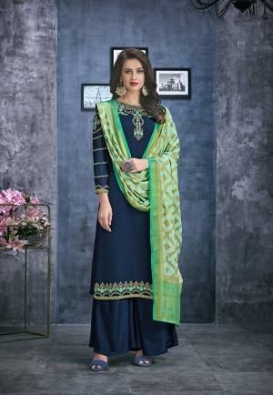 Enhance Your Personality Wearing This Designer Straight Suit In Navy Blue Color Paired With Contrasting Light Green Colored Dupatta. Its Top Is Fabricated On Satin Georgette Paired With Santoon Bottom And Jacquard Silk Fabricated Weaved Dupatta. 