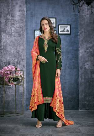 Celebrate This Festive Season Wearing This Designer Straight Cut Suit In Dark Green Color Paired With Contrasting Peach Colored Dupatta. Its Top Is Fabricated On Satin Georgette Paired With Santoon Bottom And Jacquard Silk Fabricated Dupatta. All Its Fabrics Ensures Superb Comfort All Day Long. 