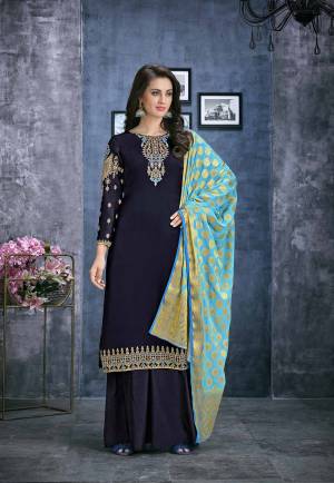 Go With The Shades Of Blue With This Designer Straight Plazzo Suit In Navy Blue Color Paired With Light Blue Colored Dupatta. Its Top Is Fabricated On Satin Georgette Paired With Santoon Bottom And Jacquard Silk Fabricated Dupatta.