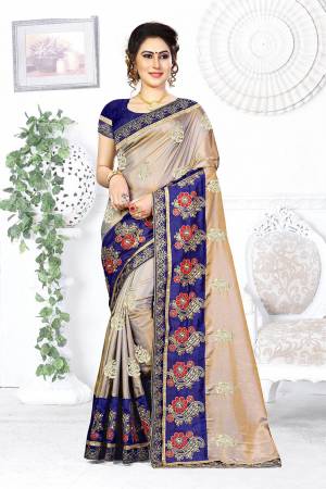 Look Pretty In This Designer Silver Colored Saree Paired With Contrasting Royal Blue Colored Blouse. This Saree And Blouse Are Silk Based Beautified With Attractive Embroidery. Buy This Designer Saree Now.