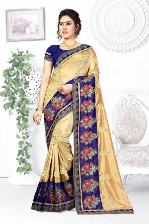 Here Is A Beautiful Designer Saree In Beige Color Paired With Contrasting Royal Blue Colored Blouse. This Saree And Blouse are Silk Based Beautified With Contrasting Embroidery Making It More Attractive. Buy This Designer Saree Now.