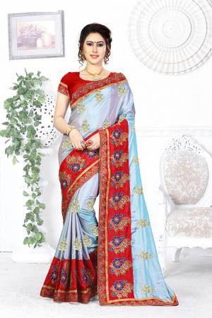 Look Pretty In This Designer Steel Blue Colored Saree Paired With Contrasting Red Colored Blouse. This Saree And Blouse Are Silk Based Beautified With Attractive Embroidery. Buy This Designer Saree Now.