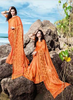 Celebrate This Festive Season Wearing This Designer Saree In Orange Color Paired With Orange Colored Blouse. This Saree Is Fabricated On Georgette Satin Paired With Art Silk Fabricated Blouse. Its Bright Color Will Give An Attractive Look To Your Personality. 