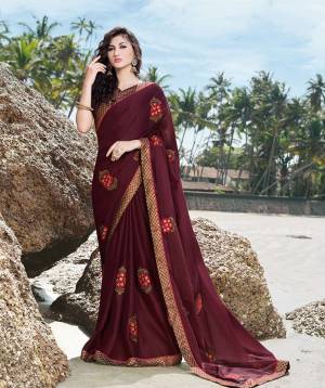 A Must Have Shade In Every Womens Wardrobe Is Here With This Designer Saree In Wine Color Paired With Brown Colored Blouse. This Saree Is Fabricated On Georgette Satin Paired With Art Silk Fabricated Blouse. Buy Now.