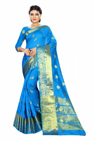 Beat This Heat This Summer Wearing This Pretty Attractive Blue Colored Saree. This Saree And Blouse Are Fabricated On Cotton Silk Beautified With Weave Butti All Over. Also It Is Light In Weight And Easy To Carry All Day Long. 