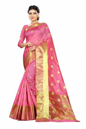 Beat This Heat This Summer Wearing This Pretty Attractive Pink Colored Saree. This Saree And Blouse Are Fabricated On Cotton Silk Beautified With Weave Butti All Over. Also It Is Light In Weight And Easy To Carry All Day Long. 