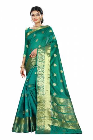 Beat This Heat This Summer Wearing This Pretty Attractive Sea Green Colored Saree. This Saree And Blouse Are Fabricated On Cotton Silk Beautified With Weave Butti All Over. Also It Is Light In Weight And Easy To Carry All Day Long. 