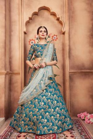 Go With The Lovely Shades Of Blue With This Heavy Designer Lehenga Choli In Blue Color Paired With Aqua Blue Colored Dupatta. Its Blouse And Lehenga Are Fabricated On Art Silk Paired With Net Fabricated Dupatta. Buy Now.