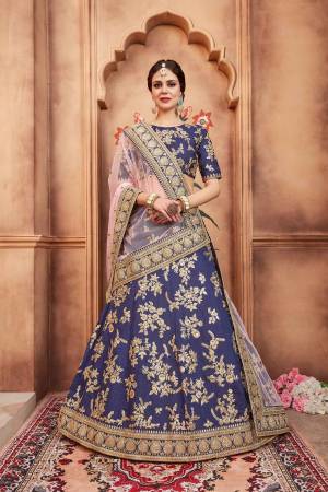 Get Ready For The Upcoming Wedding Season With This Heavy Designer Lehenga Choli In Navy Blue Color Paired With Baby Pink colored Dupatta. Its Blouse And Lehenga Are Fabricated On Art Silk Paired With Net Dupatta. 