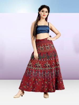Grab This Beautiful Wrap Around Skirt In Maroon Color For Your Casuals Or Semi-Casuals. This Skirt Is Fabricated On Cotton Beautified With Prints All Over.