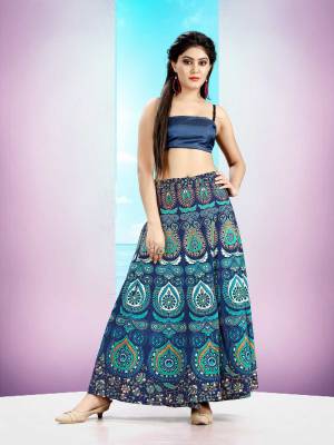 Grab This Beautiful Wrap Around Skirt In Blue Color For Your Casuals Or Semi-Casuals. This Skirt Is Fabricated On Cotton Beautified With Prints All Over.