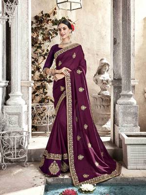 A Must Have Shade In Every Womens Wardrobe Is Here With This Designer Saree In Wine Color Paired With Wine Colored Blouse. This Saree And Blouse are Fabricated On Silk Beautified With Embroidery. Buy This Saree Now. 