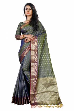 Add This Beautiful Silk Based Saree To Your Wardrobe In Grey Color Paired With Grey Colored Blouse. It Is Beautified With Attractive Butti Weave Over The Saree And Blouse. Buy Now.