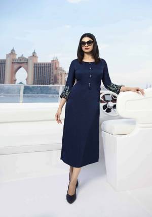 Enhance Your Personality Wearing This Designer Readymade Kurti In Navy Blue Color Fabricated On Satin Silk Beautified With Contrasting Thread And Stone Work. Buy Now.