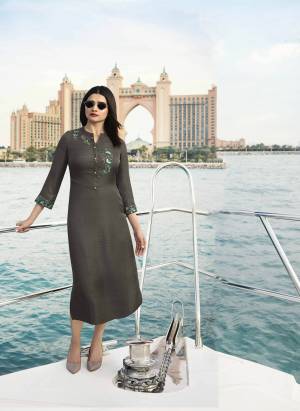Flaunt Your Rich And Elegant Taste Wearing This Designer Readymade Kurti In Grey Color Fabricated On Satin Silk Beautified With Contrasting Thread Embroidery And Stone Work. It Is Light Weight And Easy To Carry All Day Long. 