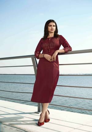 Grab This Pretty Readymade Designer Kurti In Maroon Color Fabricated On Satin Silk. This Straight Kurti Is Beautified With Embroidery With yoke And Sleeves. 