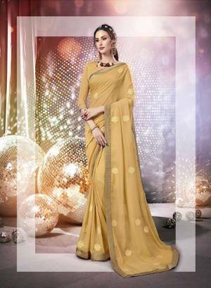Here Is A Very Pretty Designer Saree Fabricated On Chiffon Paired With Art Silk Fabricated Blouse. It Is Beautified With Tone To Tone Thread Embroidery And Stone Work Which Gives A Rich Look Overall. Buy This Saree Now.
