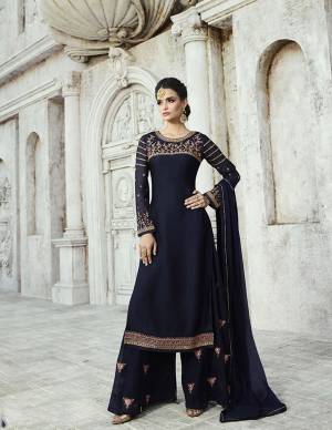 Enhance Your Personality Wearing This Designer Straight Suit In Navy Blue Color Paired With Navy Blue Colored Bottom And Dupatta. Its Top Is Fabricated On Satin Georgette Paired With Georgette Bottom And Chiffon Dupatta. Its Top And Bottom Are Beautified With Attractive Embroidery. 