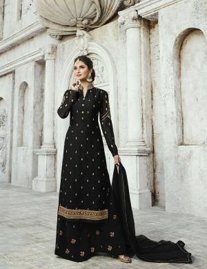 For A Bold And Beautiful Look, Grab This Designer Straight Cut Plaazo Suit In Black Color. Its Top Is Fabricated On Satin Georgette Paired With Georgette Bottom And Chiffon Fabricated Dupatta. Buy This Semi-Stitched Suit Now.