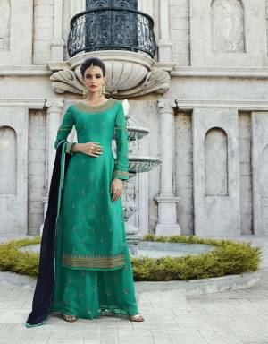 Grab This Beautiful Designer Straight Suit In Sea Green Color Paired With Sea Green Colored Bottom And Contrasting Navy Blue Colored Dupatta. 