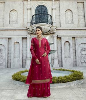 Shine Bright In This Designer Straight Suit In Dark Pink Color Paired With Dark Pink Colored Bottom And Dupatta. Its Top Is Fabricated On Satin Georgette Paired With Georgette Bottom And Chiffon Fabricated Dupatta. It Is Light Weight And Easy To Carry Throughout The Gala. 
