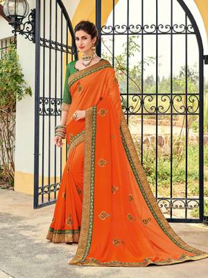 Flaunt your gorgeous look wearing this orange color two tone silk shaded saree. Ideal for party, festive & social gatherings. this gorgeous saree featuring a beautiful mix of designs. Its attractive color and designer heavy embroidered design, Flower embroidered butta design, stone design, beautiful floral design work over the attire & contrast hemline adds to the look. Comes along with a contrast unstitched blouse.