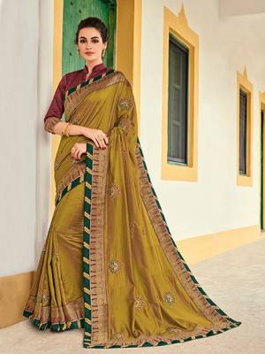 The fabulous pattern makes this saree a classy number to be included in your wardrobe. Pear green color two tone silk saree. Ideal for party, festive & social gatherings. this gorgeous saree featuring a beautiful mix of designs. Its attractive color and designer heavy embroidered design, Flower embroidered butta design, stone design, beautiful floral design work over the attire & contrast hemline adds to the look. Comes along with a contrast unstitched blouse.