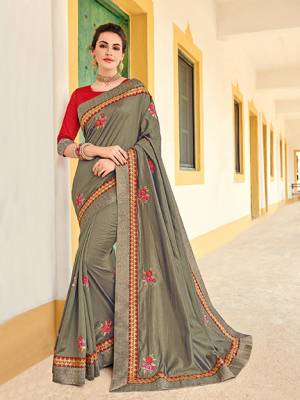 You Look elegant and stylish this festive season by draping this grey color two tone silk saree. Ideal for party, festive & social gatherings. this gorgeous saree featuring a beautiful mix of designs. Its attractive color and designer heavy embroidered design, Flower embroidered butta design, stone design, beautiful floral design work over the attire & contrast hemline adds to the look. Comes along with a contrast unstitched blouse.
