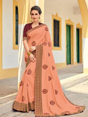 Bring out the best in you when wearing this peach color silk fabrics saree. Ideal for party, festive & social gatherings. this gorgeous saree featuring a beautiful mix of designs. Its attractive color and designer heavy embroidered design, Flower embroidered butta design, stone design, beautiful floral design work over the attire & contrast hemline adds to the look. Comes along with a contrast unstitched blouse.