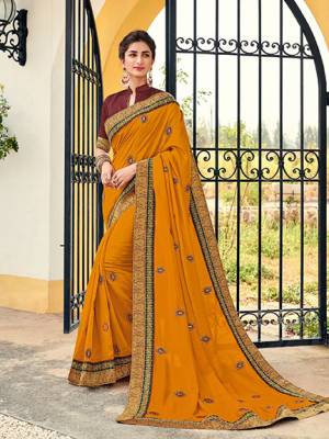 Vibrant and visually appealing, this Musturd yellow color silk pattern saree. Ideal for party, festive & social gatherings. this gorgeous saree featuring a beautiful mix of designs. Its attractive color and designer heavy embroidered design, Flower embroidered butta design, stone design, beautiful floral design work over the attire & contrast hemline adds to the look. Comes along with a contrast unstitched blouse.