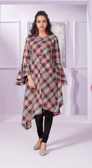 Assymetric Patterned Designer Readymade Kurti Is Here In Grey Color Fabricated On Cotton. It Is Beautified With Red And Grey Colored Checks All Over. 