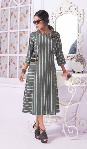 You Will Definitely Earn Lots Of Compliments Wearing This Readymade Formal Pattaerned Kurti In Grey Color. This Kurti Is Cotton Based Beautified With Lining Prints. Buy Now.
