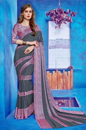 Add Some Casulas With This Beautiful Printed Saree Fabricated On Georgette Paireed With Satin Fabricated Blouse. This Saree Is Beautified With Printed Satin Patta Giving It An Attractive Look. 