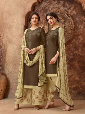 Simple And elegant Looking Straight Suit Is Here In Brown Colored Top Paired With Cream Colored Bottom And Dupatta. This Dress Material Is Cotton Based Paired With Chiffon Fabricated Dupatta. Get This Stitched As A Plazzo Or Salwar As Per Your Desired Comfort. 