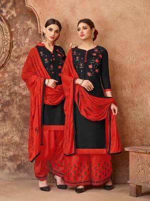 Celebrate This Festive Season With Ease, Comfort And Beauty By Getting This Dress Material Stitched As Per Your Desired Fit And Comfort. Its Top Is In Black Color Paired With Contrasting Red Colored Bottom And Dupatta. This Dress Material Is Fabricated On Cotton Paired With Chiffon Dupatta. 