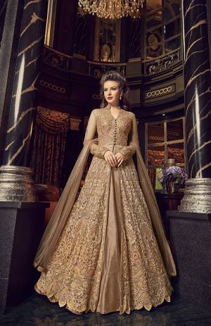 Flaunt Your Rich And Elegant Taste In This Designer Indo-Western Suit In Beige Color. Its Top And Dupatta Are Net Based With Heavy Embroidery, Available With A Lehenga And Embroidered Pants. Its Lehenga And Pants Are Fabricated On Art Silk. You Can Pair With Any Of Them As Per The Occasion.