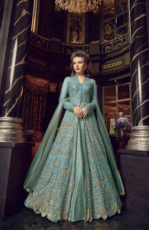 Flaunt Your Rich And Elegant Taste In This Designer Indo-Western Suit In Turquoise Blue Color. Its Top And Dupatta Are Net Based With Heavy Embroidery, Available With A Lehenga And Embroidered Pants. Its Lehenga And Pants Are Fabricated On Art Silk. You Can Pair With Any Of Them As Per The Occasion.