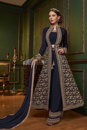 New Patterned Designer Indo-Western Dress Is Here In Navy Blue Color. It Has Heavy Embroidered Top And Plazzo Pants Fabricated On Georgette Paired With Chiffon Dupatta. This Pretty Designer Dress Will Definitely Earn You Lots Of Compliments From Onlookers.