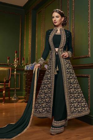 New Patterned Designer Indo-Western Dress Is Here In Dark Green Color. It Has Heavy Embroidered Top And Plazzo Pants Fabricated On Georgette Paired With Chiffon Dupatta. This Pretty Designer Dress Will Definitely Earn You Lots Of Compliments From Onlookers.