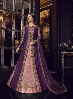 Add This Elegant And New Patterned Indo-Western Dress To Your Wardrobe In Shades Of Pink. It Has Very Pretty Pink Colored Gown With A Purple Colored Jacket Paired With Pink Colored Embroidered Pants And Purple Dupatta. Its Heavy Embroidered Gown Is Net Based Paired With Art Silk Jacket , Art Silk Pant And Net Fabricated Dupatta. 