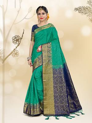 Here Is A Very Beautiful Silk Based Saree Isea Gren Color Paired With Navy Blue Colored Blouse. This Saree And Blouse Are Fabricated On Embossed Jacquard Beautified With Weave All Over. 
