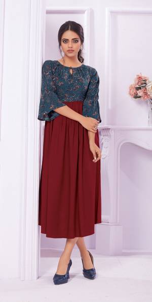 Grab This Pretty Readymade Kurti For Your Semi-Casual Wear In Maroon And Blue Color Fabricated On Rayon Beautified With Prints Over The Yoke. 