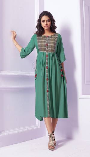 Here Is A Pretty Shade In Green With This Readymade Designer Kurti In Sea Green Color Fabricated On Rayon. It Is Soft Towards Skin And Easy To Carry All Day Long. 