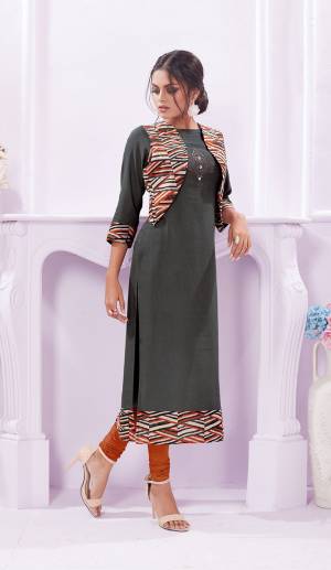 Rich And Elegant Looking Designer Readymade Kurti Is Here In Grey Color Fabricated On Rayon Paired With Printed Jacket.