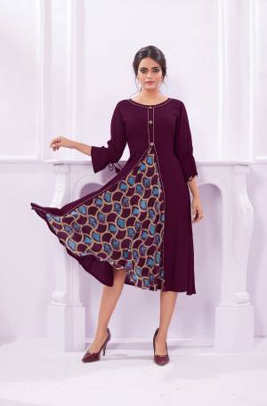 Add This New Shade To Your Wardrobe With This Designer Readymade Kurti In Wine Color Fabricated On Rayon. This Kurti Is Light Weight And Easy To Carry All Day Long. 