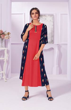 New And Unique Patterned Designer Readymade Kurti Is Here In Red And Navy Blue Color Fabricated On Rayon. It Is Beautified With Prints Ans Its Fabrics Ensures Superb Comfort all Day Long.  