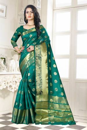 Beat This Heat This Summer Wearing This Pretty Attractive Teal Green Colored Saree. This Saree And Blouse Are Fabricated On Banarasi Art Silk Beautified With Weave Butti All Over. Also It Is Light In Weight And Easy To Carry All Day Long