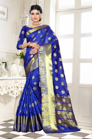 Beat This Heat This Summer Wearing This Pretty Attractive Royal Blue Colored Saree. This Saree And Blouse Are Fabricated On Banarasi Art Silk Beautified With Weave Butti All Over. Also It Is Light In Weight And Easy To Carry All Day Long